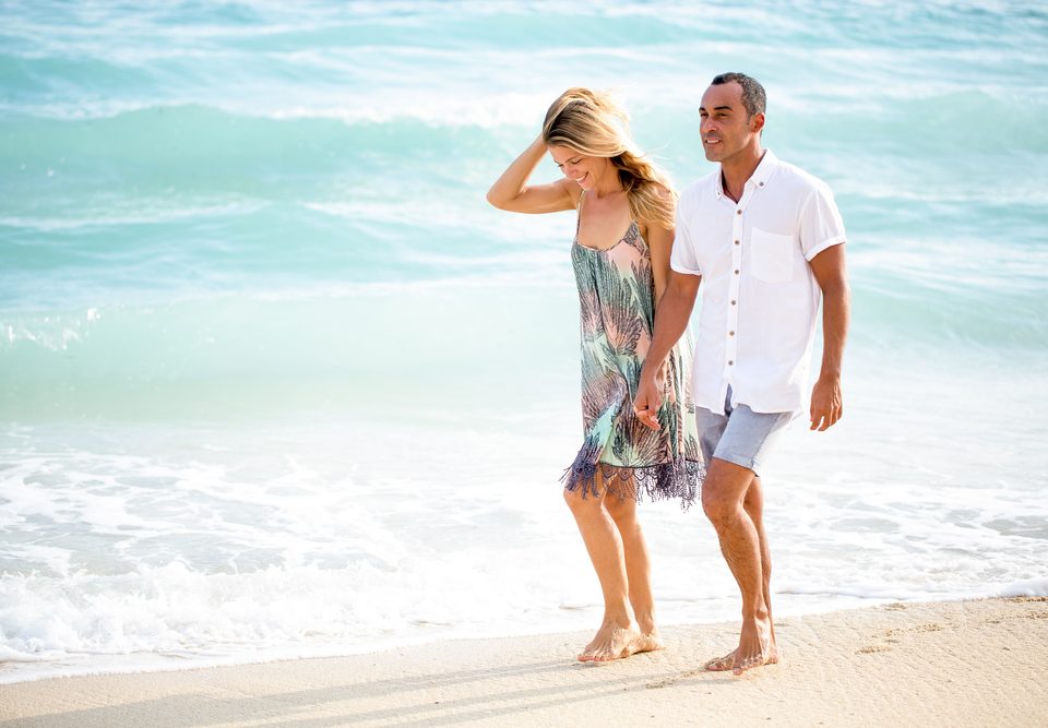 couple walking down the beach